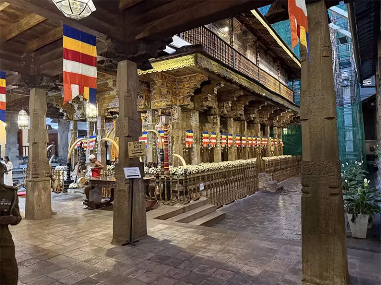 temple of the Sacred Tooth Relic tomb and tusks drummer