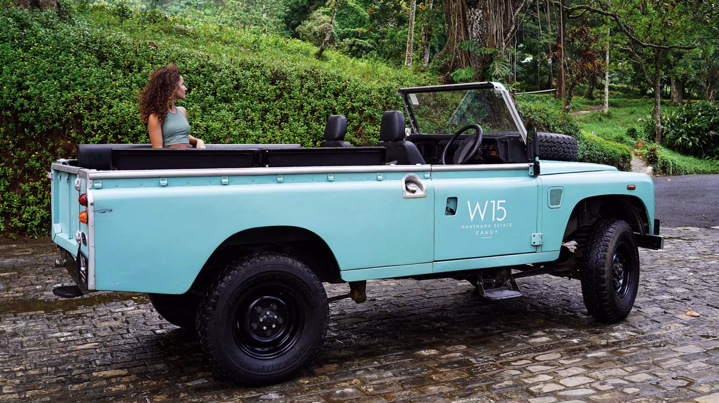 W15 Landrover jeep and woman